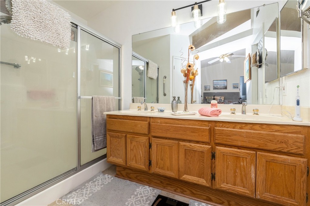 26592 Braddock Road Menifee, CA 92586 - Photo 15 of 25 a bathroom with a sink and a mirror