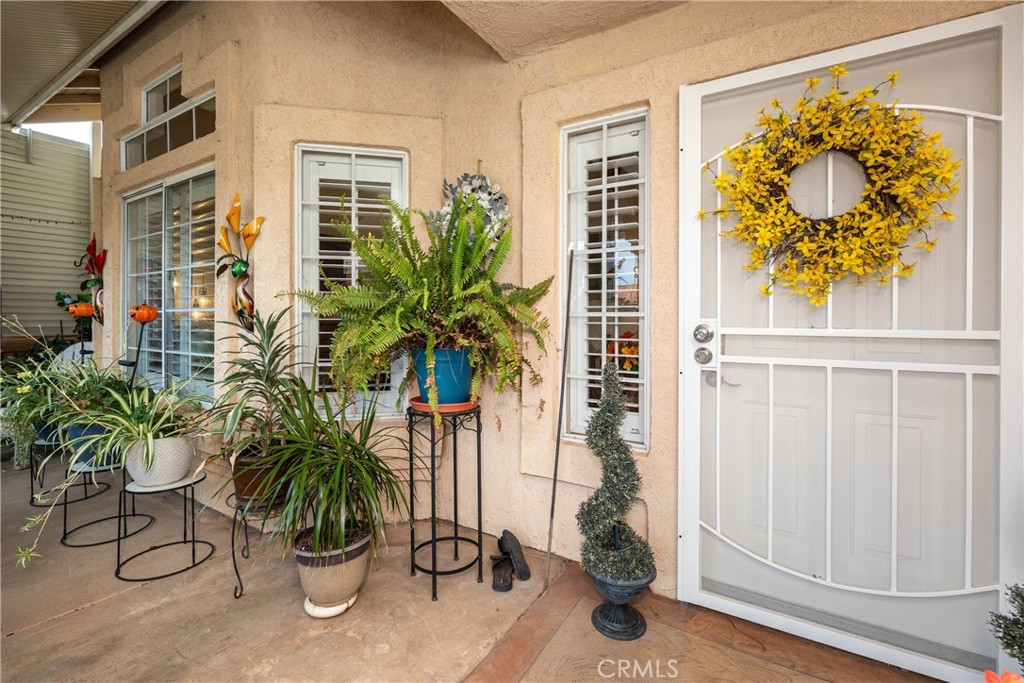 26592 Braddock Road Menifee, CA 92586 - Photo 2 of 25 a potted plant sitting in front of a house