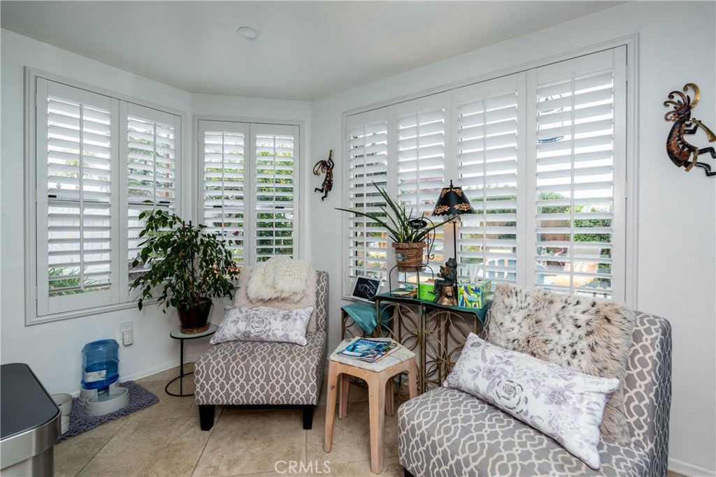 26592 Braddock Road Menifee, CA 92586 - Photo 4 of 25 a living room with furniture and a large window