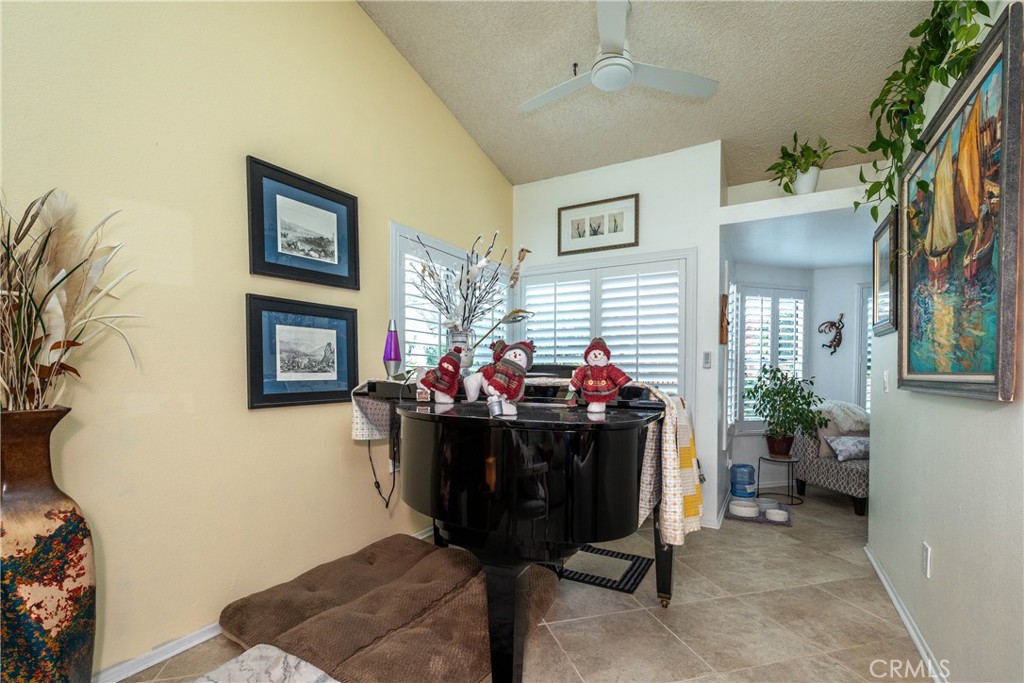 26592 Braddock Road Menifee, CA 92586 - Photo 5 of 25 a living room with furniture a rug and a fireplace