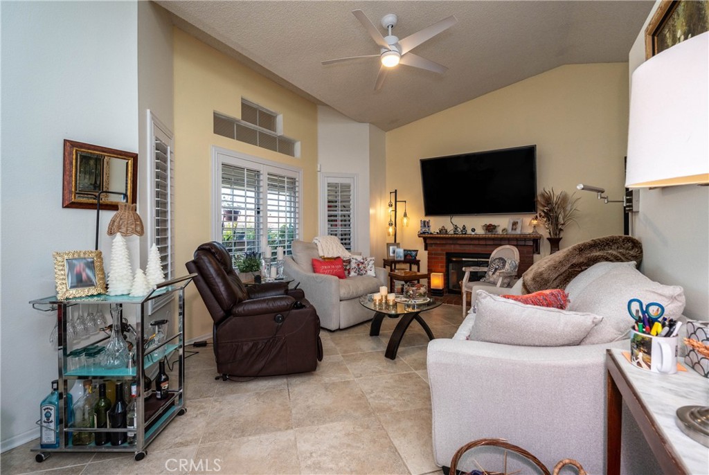 26592 Braddock Road Menifee, CA 92586 - Photo 7 of 25 a living room with furniture a flat screen tv and a window