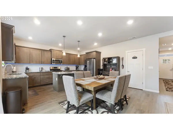 a kitchen with a table and chairs