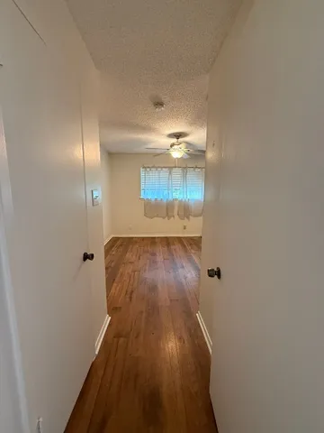 a view of a livingroom with wooden floor
