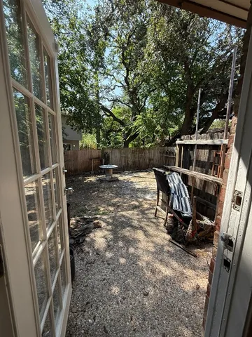 a view of a chairs and table in the balcony