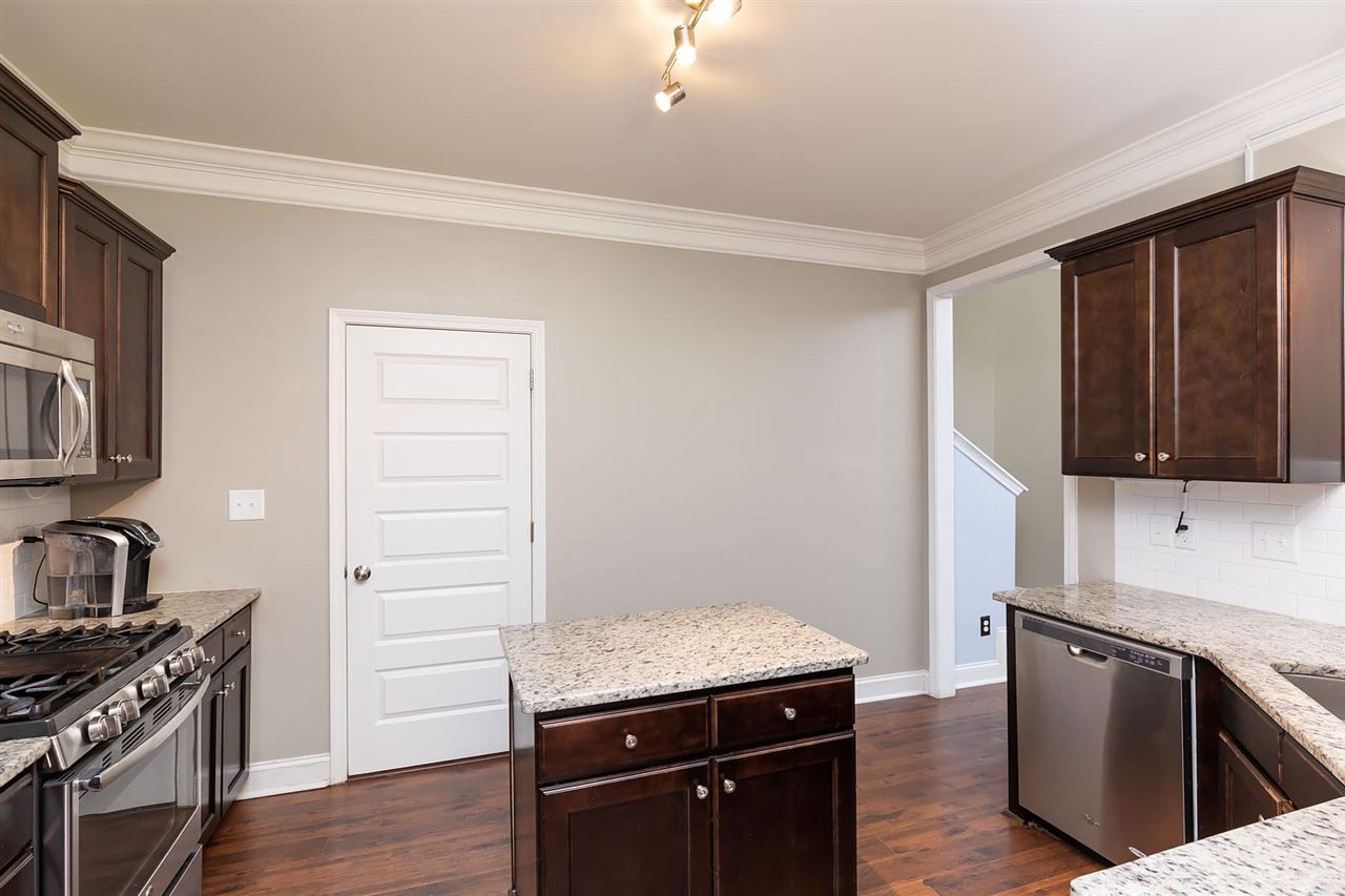 3916 Pecan Grove Road Zebulon, NC 27597 - Photo 14 of 30 Doorway access to large pantry, washer and dryer, mudroom, and Garage. Kitchen