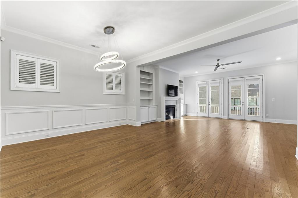 2131 Bellrick Road Northwest Atlanta, GA 30318 - Photo 11 of 57 a view of an empty room with wooden floor and a window