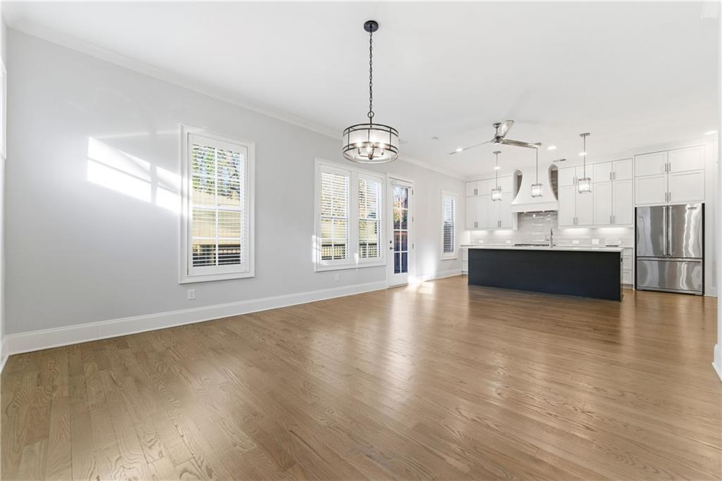 2131 Bellrick Road Northwest Atlanta, GA 30318 - Photo 21 of 57 a view of a big room with wooden floor and windows