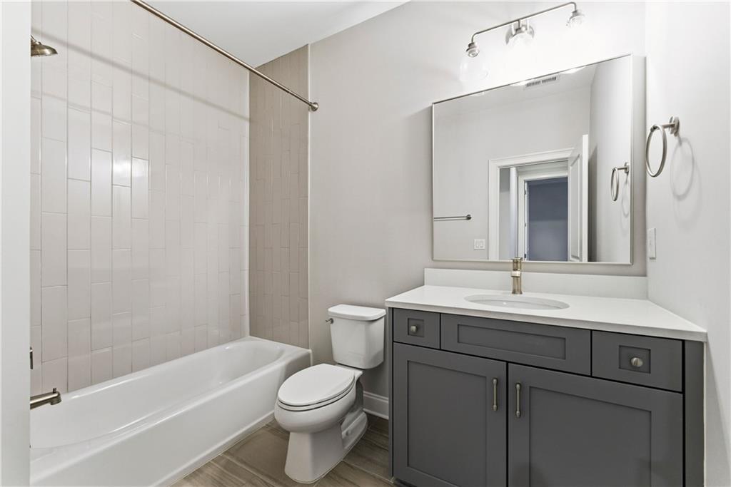 2131 Bellrick Road Northwest Atlanta, GA 30318 - Photo 24 of 57 a bathroom with a sink a toilet and shower