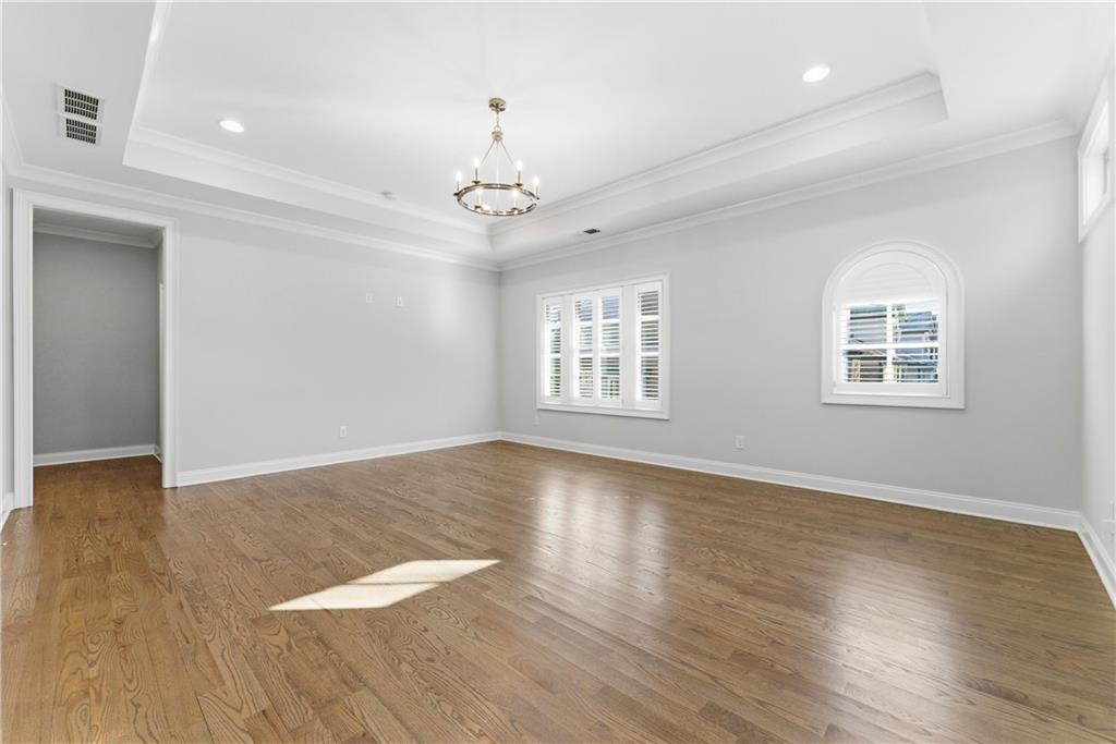 2131 Bellrick Road Northwest Atlanta, GA 30318 - Photo 27 of 57 a view of an empty room with wooden floor and a window