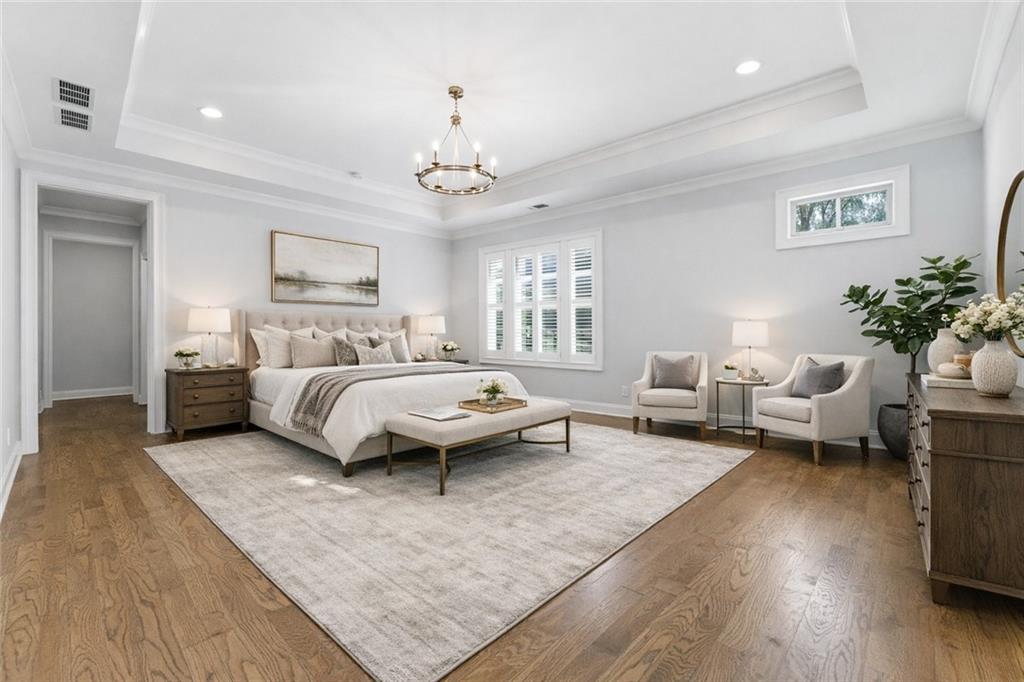 2131 Bellrick Road Northwest Atlanta, GA 30318 - Photo 28 of 57 a spacious bedroom with a bed couch and a window