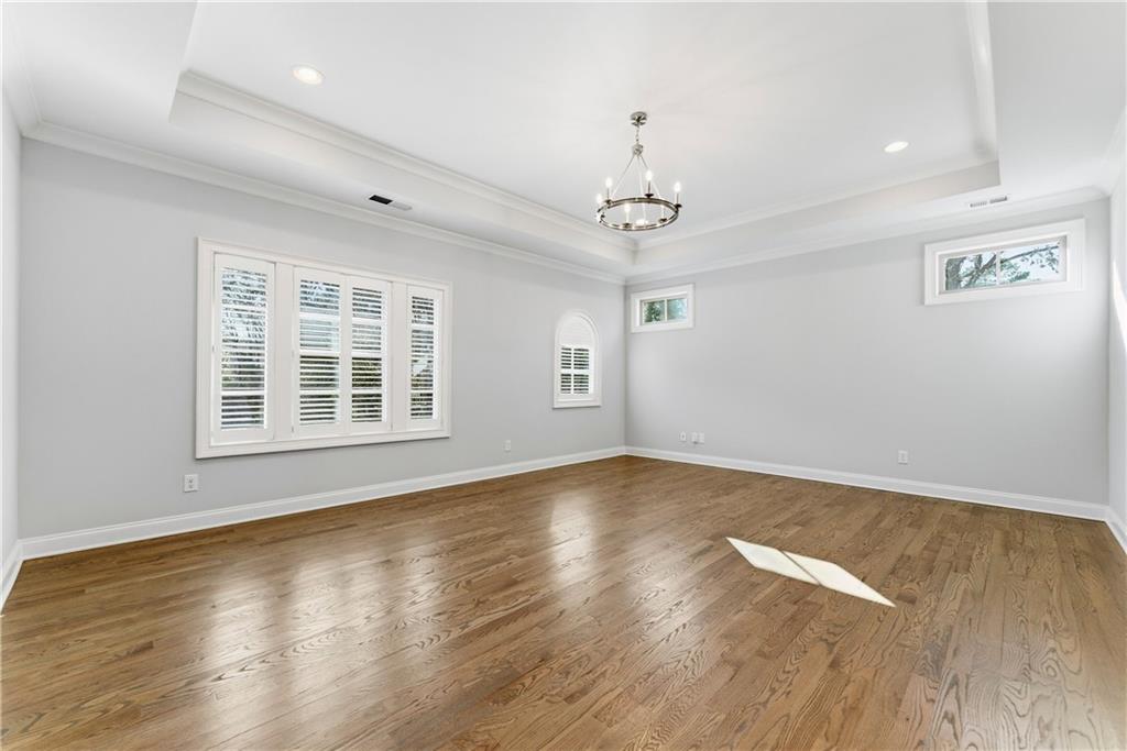 2131 Bellrick Road Northwest Atlanta, GA 30318 - Photo 29 of 57 a view of an empty room with wooden floor and a window