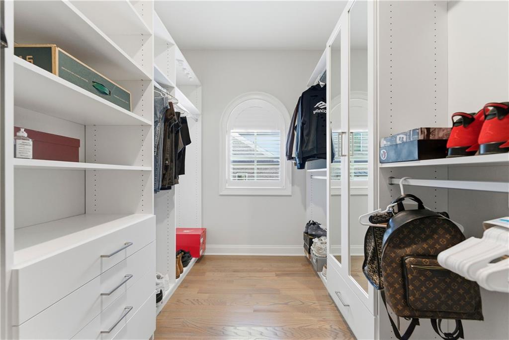 2131 Bellrick Road Northwest Atlanta, GA 30318 - Photo 38 of 57 a view of walk in closet with clothes and shoes