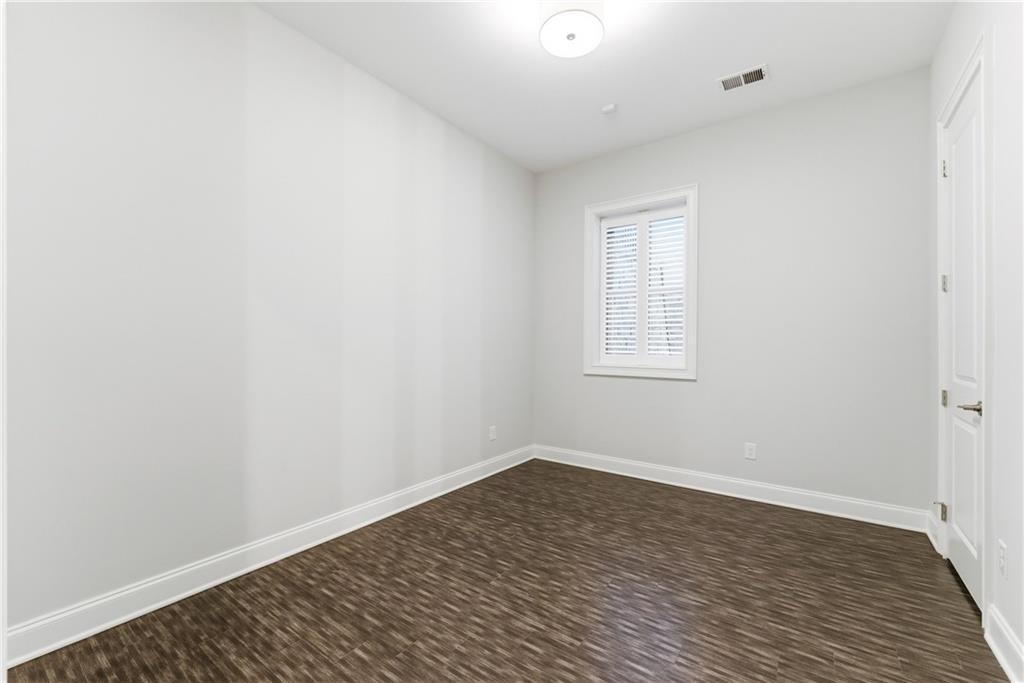2131 Bellrick Road Northwest Atlanta, GA 30318 - Photo 42 of 57 wooden floor in an empty room
