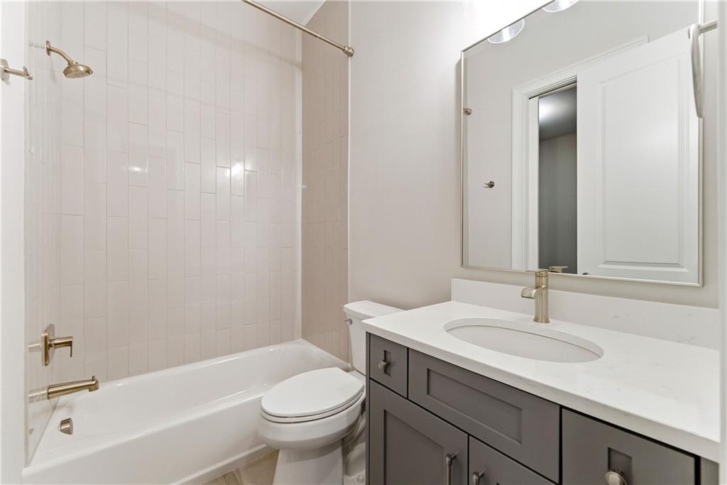 2131 Bellrick Road Northwest Atlanta, GA 30318 - Photo 43 of 57 a bathroom with a sink a toilet and shower