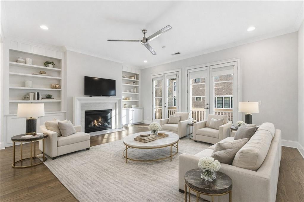 2131 Bellrick Road Northwest Atlanta, GA 30318 - Photo 7 of 57 a living room with furniture a fireplace and a flat screen tv