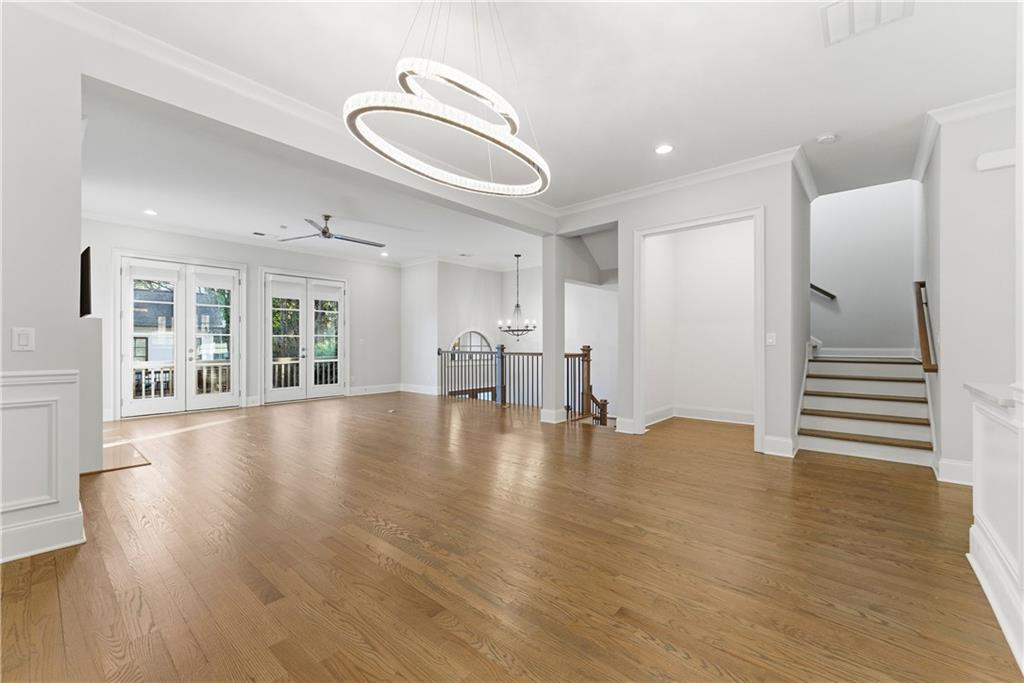 2131 Bellrick Road Northwest Atlanta, GA 30318 - Photo 10 of 57 a view of empty room with wooden floor and windows