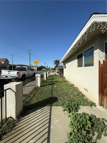 a view of a house with backyard and deck