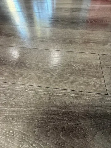 a room with a chair and a window