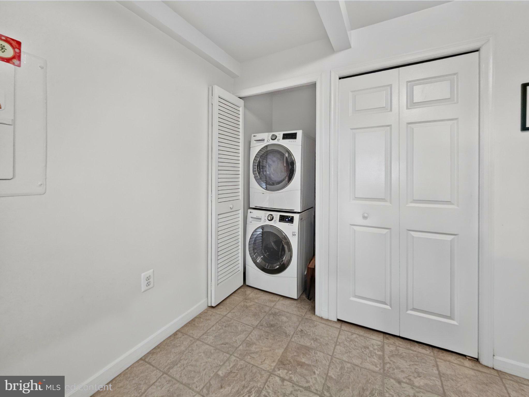 1301 North Courthouse Road, Unit 1803 Arlington, VA 22201 - Photo 18 of 35 Efficient laundry nook in bright space.