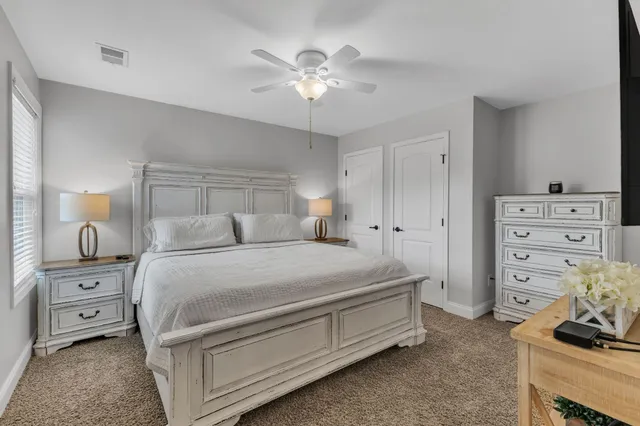 a bedroom with a bed and a tv