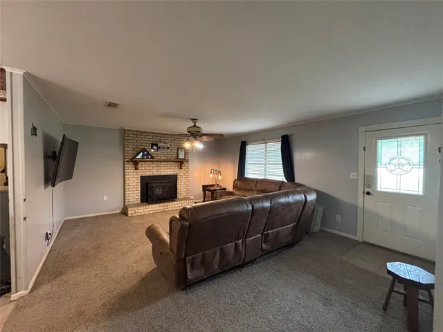 a spacious bedroom with a bed and a fireplace