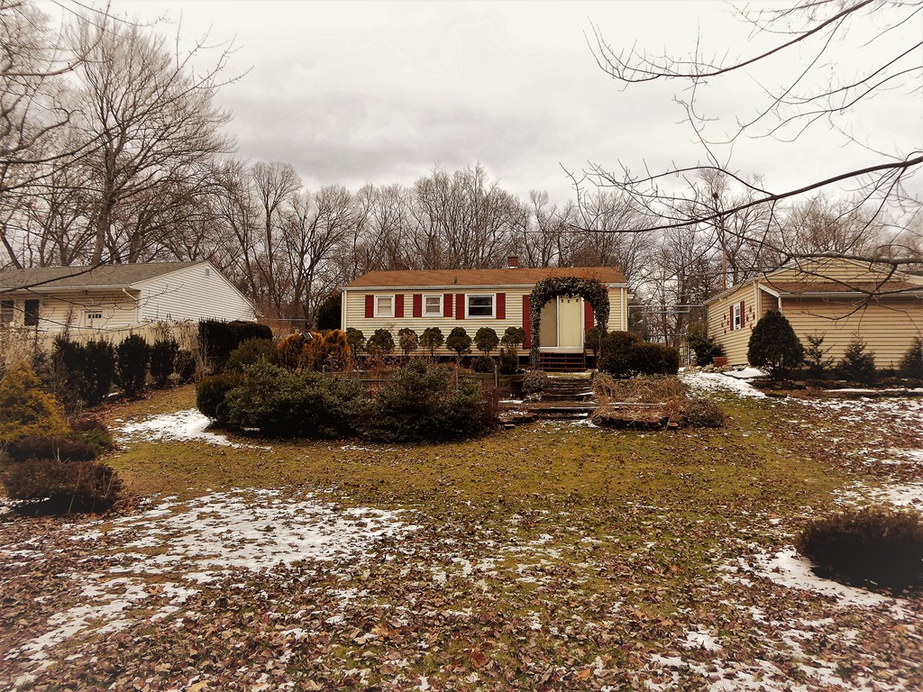 100 Hudson Street Springfield, MA 01118 - Photo 2 of 30 a view of a house with a yard covered in snow