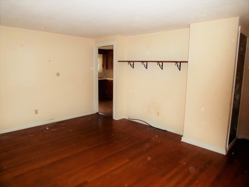 100 Hudson Street Springfield, MA 01118 - Photo 4 of 30 an empty room with wooden floor