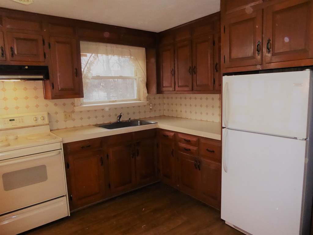 100 Hudson Street Springfield, MA 01118 - Photo 6 of 30 a kitchen with a refrigerator sink and cabinets