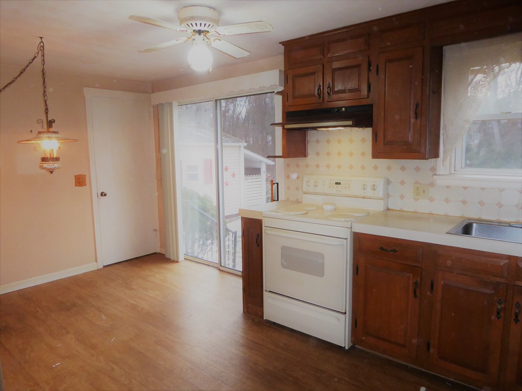 100 Hudson Street Springfield, MA 01118 - Photo 7 of 30 a kitchen with stainless steel appliances granite countertop a sink stove and refrigerator
