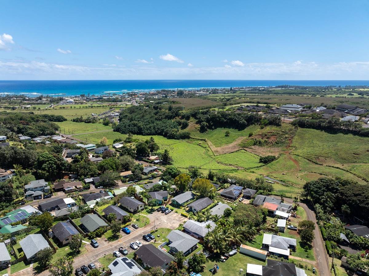 4920 Aliali Road, Unit 11 Kapaa, HI 96746 - Photo 28 of 30 an aerial view of residential houses with outdoor space and trees