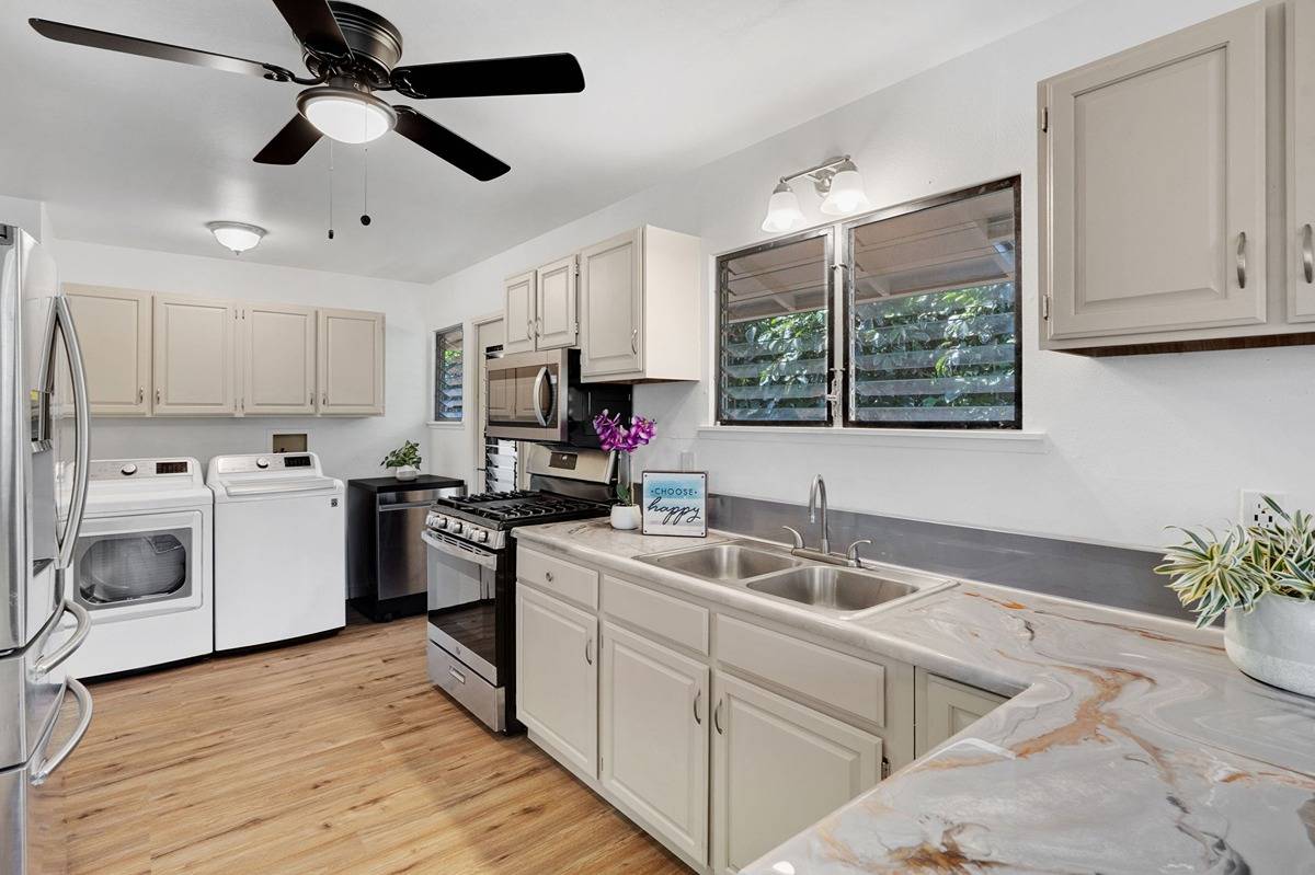 4920 Aliali Road, Unit 11 Kapaa, HI 96746 - Photo 9 of 30 a kitchen with appliances cabinets a sink and a counter top space