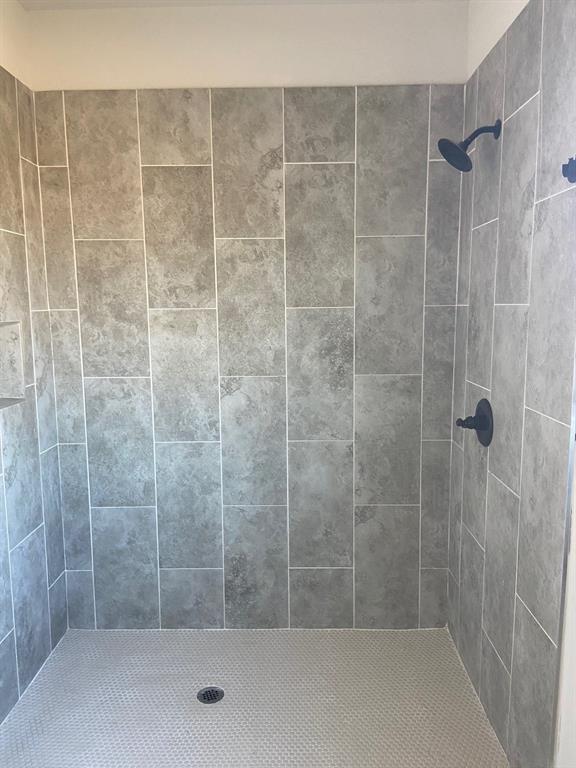 1589 Stiles Road Whitesboro, TX 76273 - Photo 11 of 22 a bathroom with a shower