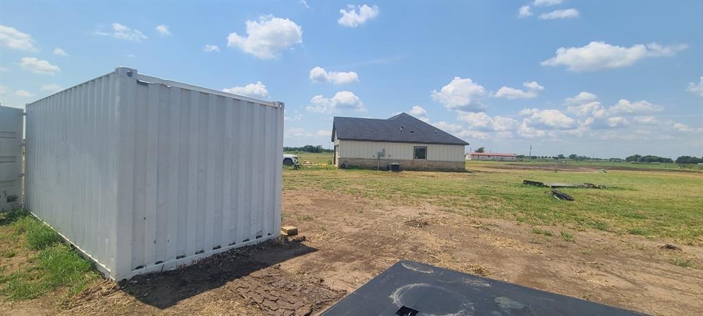 1589 Stiles Road Whitesboro, TX 76273 - Photo 19 of 22 a view of a house with backyard and balcony
