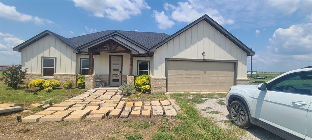 1589 Stiles Road Whitesboro, TX 76273 - Photo 3 of 22 a front view of a house with garden