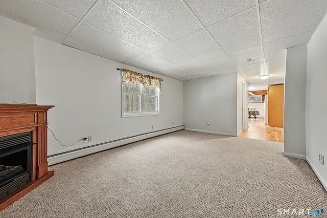 a view of a swimming pool with a patio and a yard