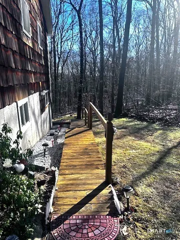 a view of pool with a yard