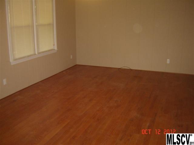 4122 Beach Road Hudson, NC 28638 - Photo 2 of 20 an empty room with a window
