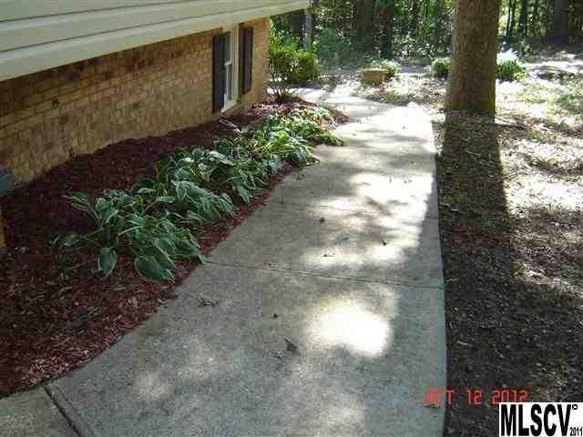 4122 Beach Road Hudson, NC 28638 - Photo 11 of 20 a view of a yard with plants in front of main door