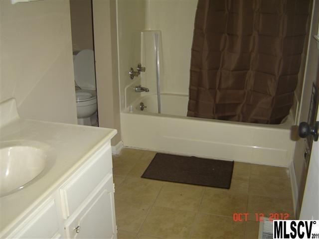 4122 Beach Road Hudson, NC 28638 - Photo 3 of 20 a bathroom with a bathtub and a shower