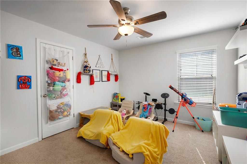 405 Crowley Drive Calhoun, GA 30701 - Photo 19 of 33 a children room with toys and a fan