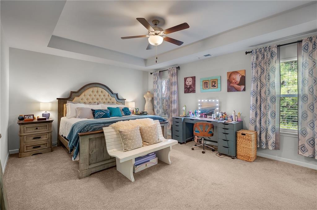 405 Crowley Drive Calhoun, GA 30701 - Photo 20 of 33 a bedroom with a bed and a chandelier