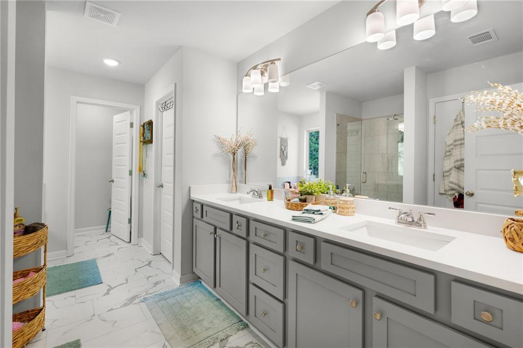 405 Crowley Drive Calhoun, GA 30701 - Photo 22 of 33 a bathroom with a double vanity sink mirror and shower
