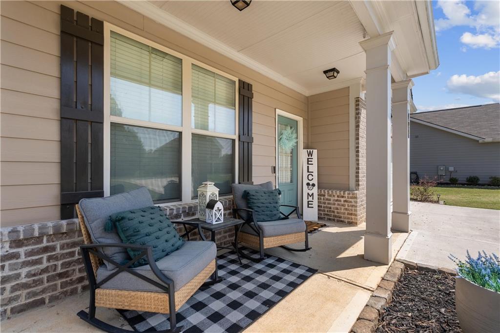 405 Crowley Drive Calhoun, GA 30701 - Photo 3 of 33 a outdoor space with patio couches and a potted plant on a table