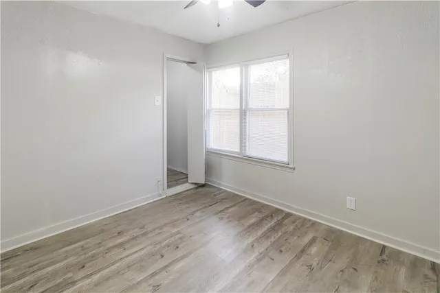 a bathroom with a bathtub and a toilet