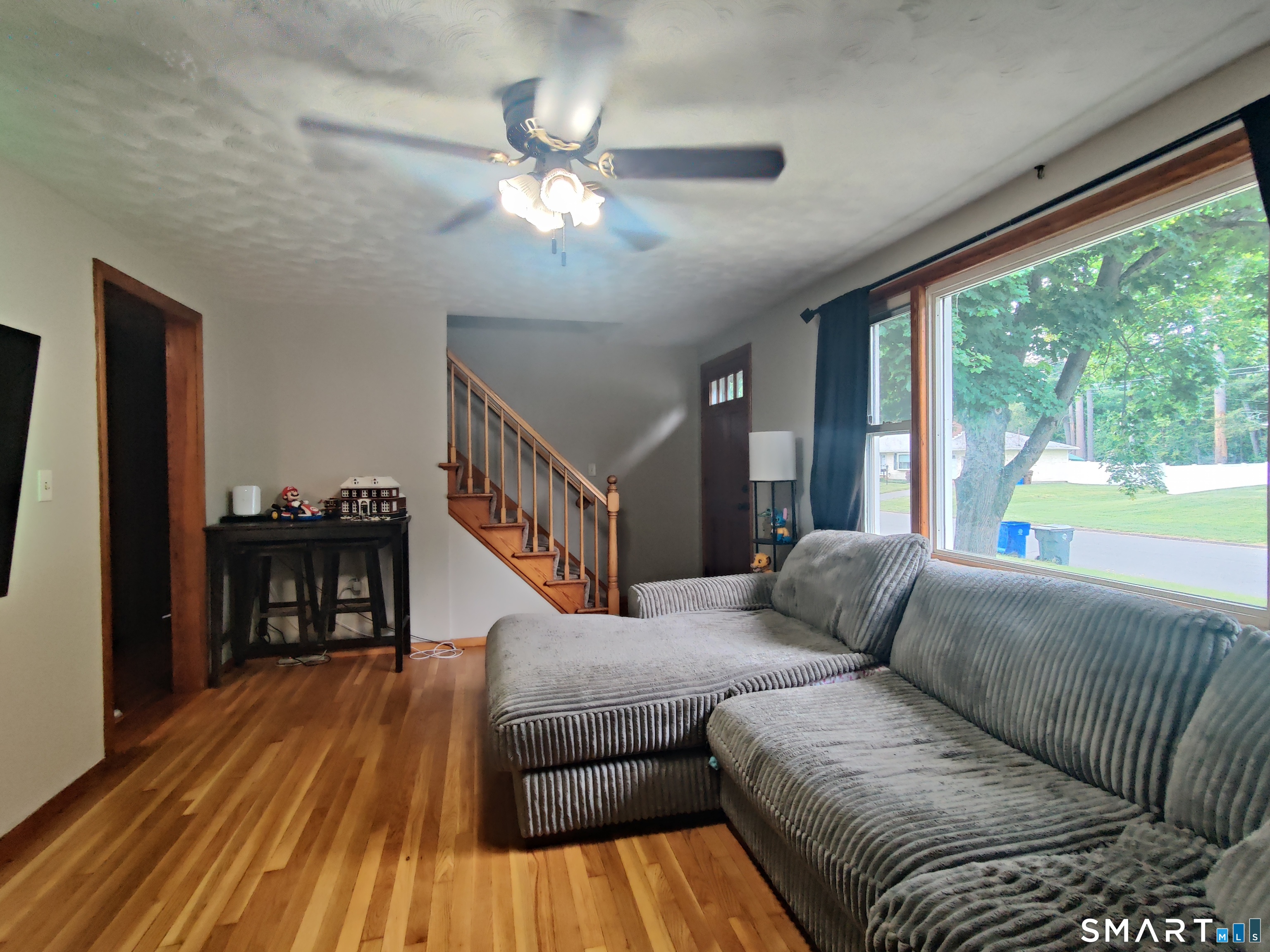 35 Brook Road Enfield, CT 06082 - Photo 9 of 25 a living room with furniture and a wooden floor