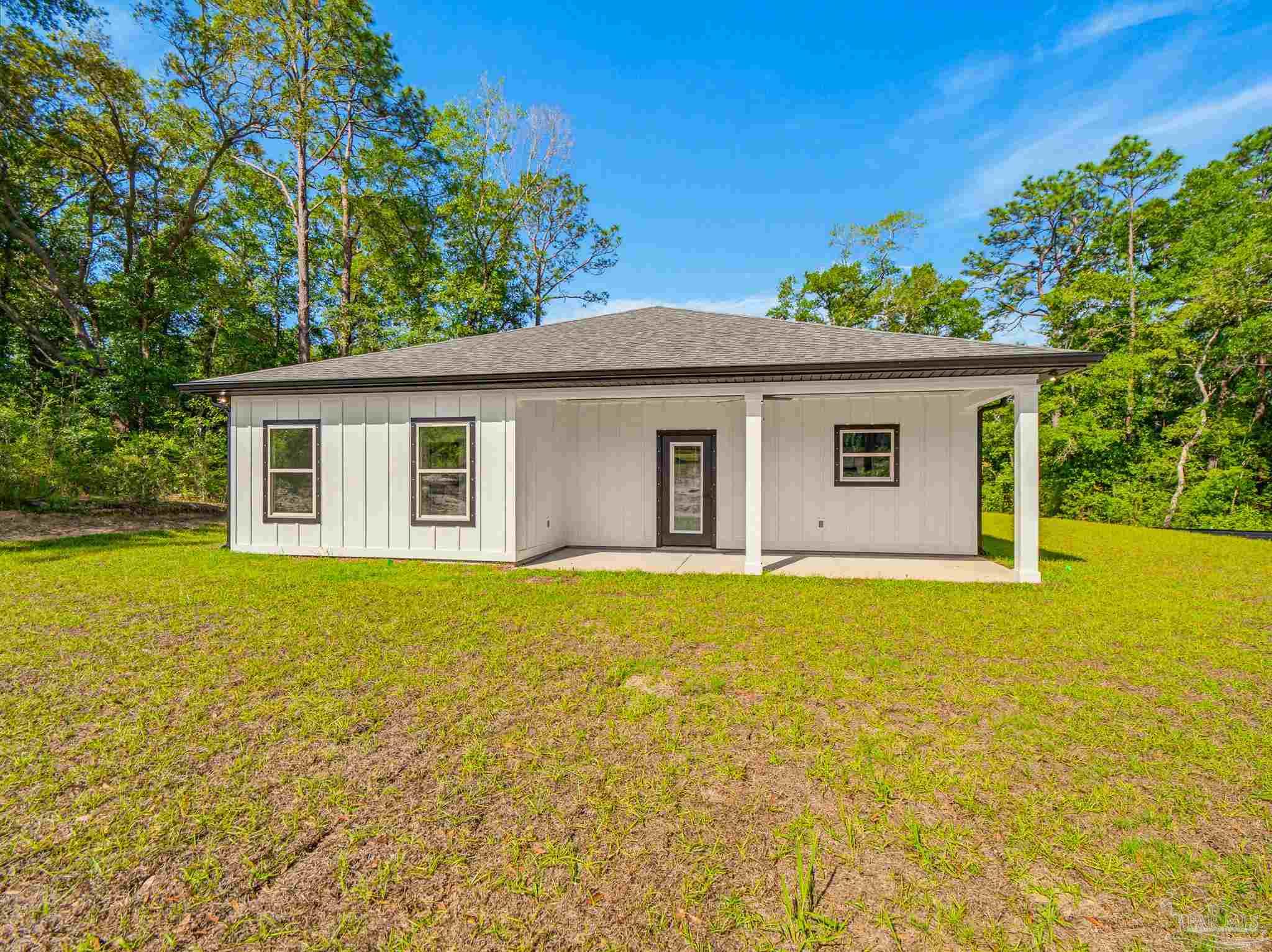 5724 Riviera Drive Milton, FL 32583 - Photo 50 of 52 a view of a house with backyard and garden