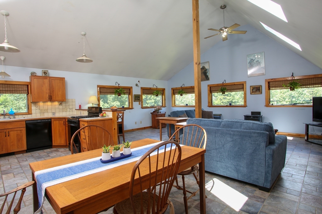 14 S Road Heath, MA 01346 - Photo 14 of 38 a living room with lots of furniture and a dining table with kitchen view