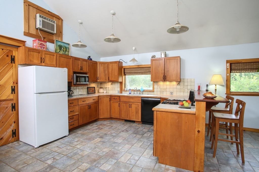 14 S Road Heath, MA 01346 - Photo 16 of 38 a kitchen with cabinets and a refrigerator