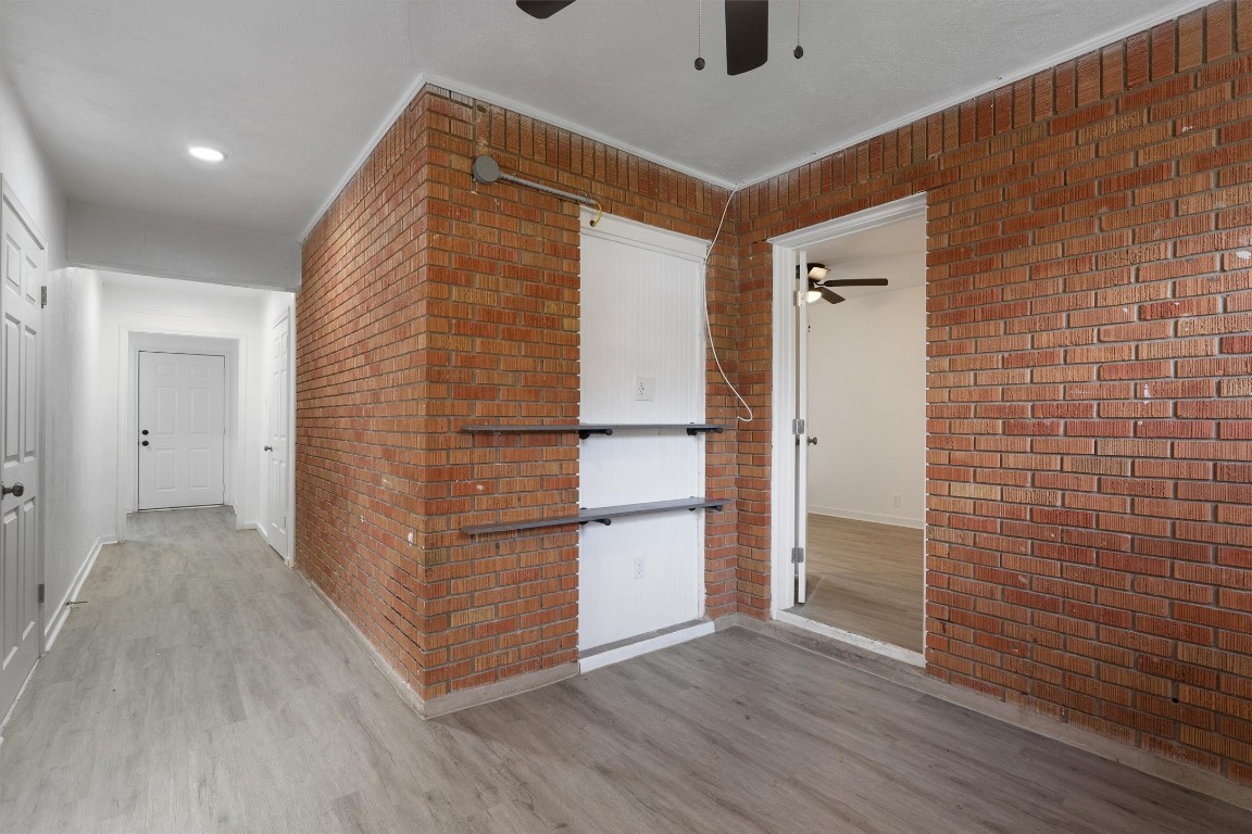 10205 Old Manchaca Road, Unit B Austin, TX 78748 - Photo 11 of 24 a view of empty room with wooden floor