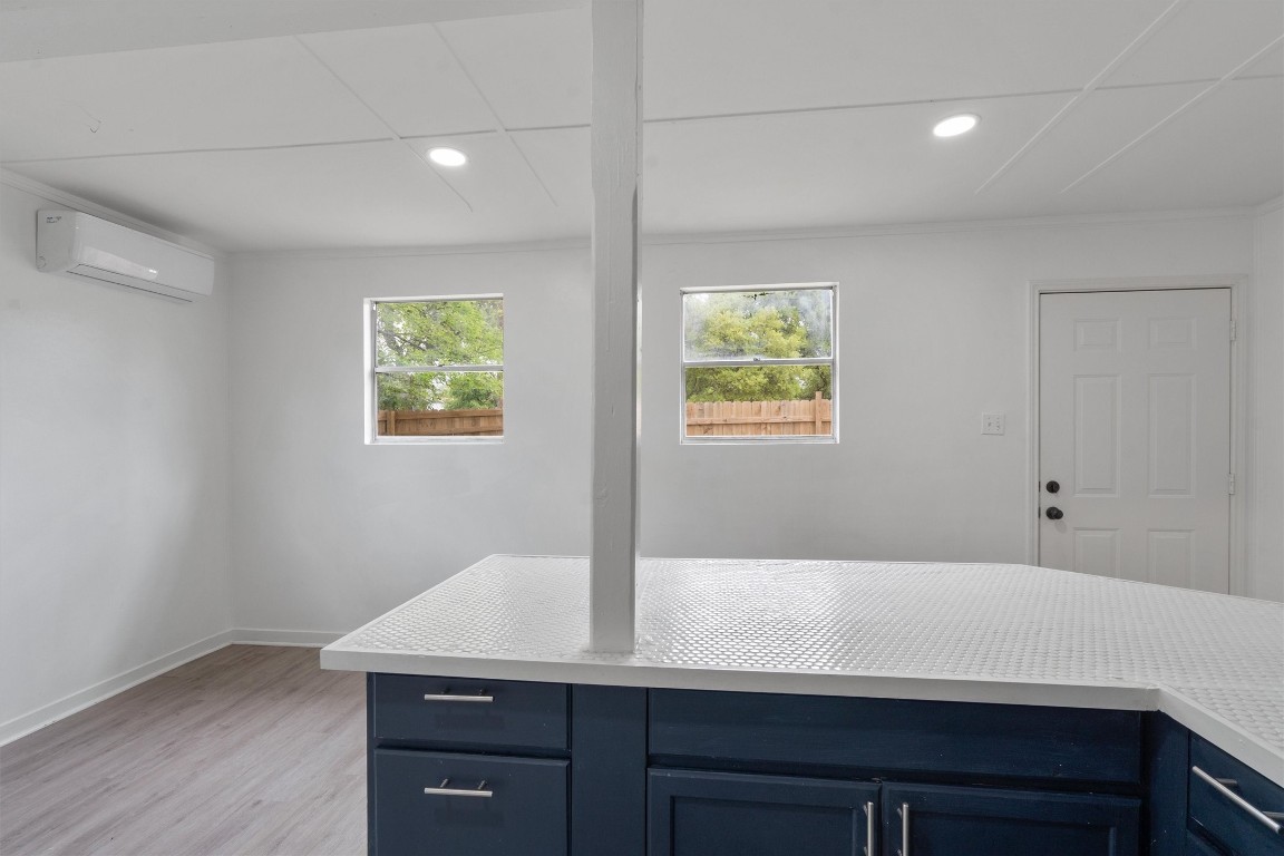 10205 Old Manchaca Road, Unit B Austin, TX 78748 - Photo 20 of 24 a view of room with window and wooden floor